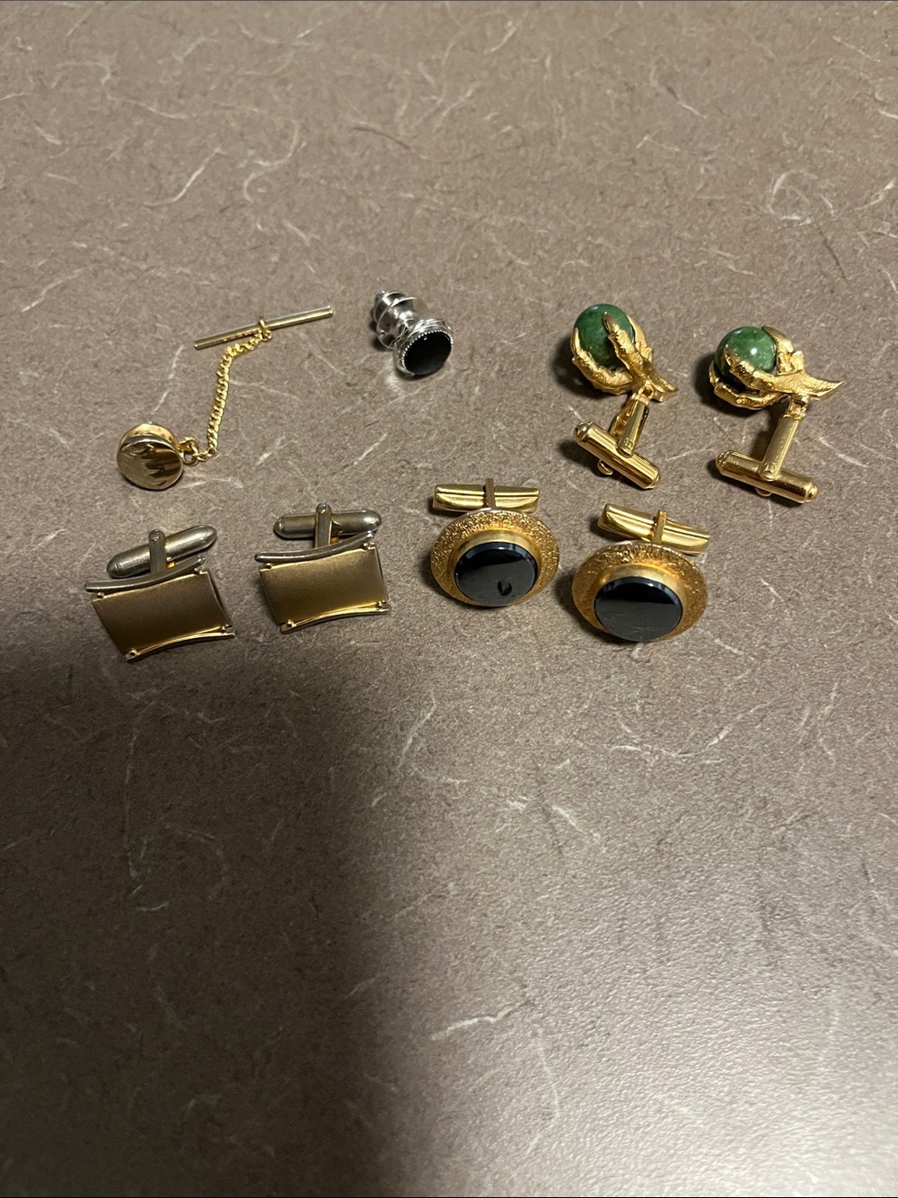 Men’s assorted cuff links and tie pin. Some Swank brand